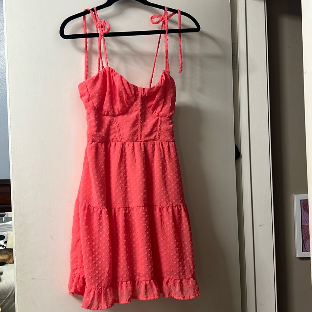 Cute party dress!  A beautiful shade of pink/orange, adjustable spaghetti straps
